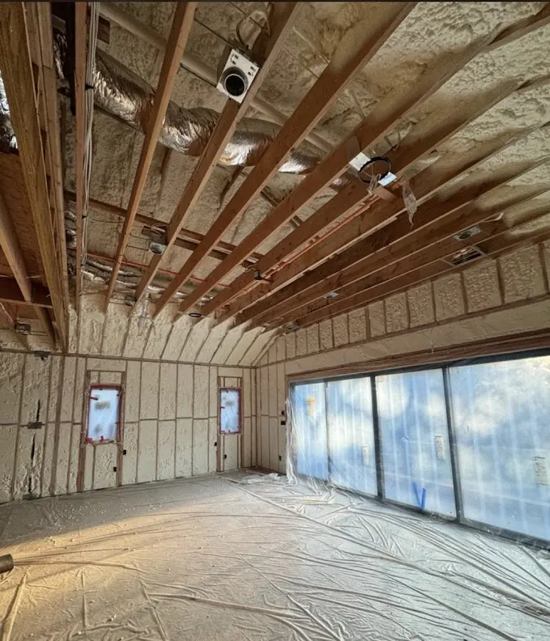 Interior walls and ceiling insulated with spray foam during new construction in Mims